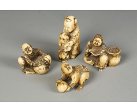 FOUR JAPANESE IVORY NETSUKE, the larger example of a boy with two puppies, Meiji, 1.75" high; the three smaller examples show