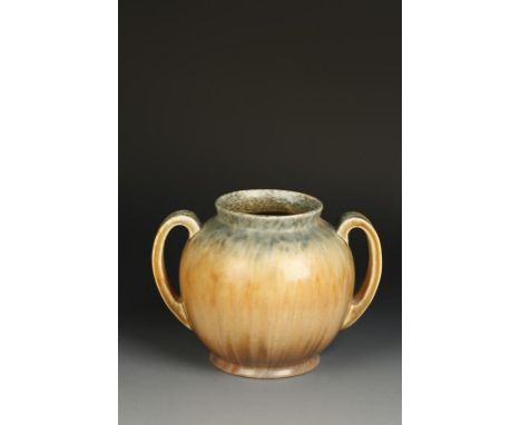 A RUSKIN POTTERY TWO-HANDLED VASE decorated in a graduated brown, orange and sage matt glaze, the underside with impressed Ru