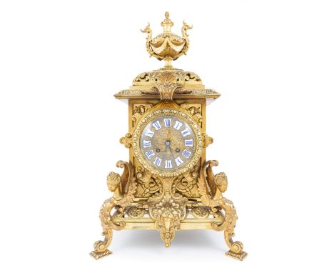 French gilt metal mantel clock, early 20th century, enamelled numerals and rococo scrolled dial, cylinder movement by S. Mart