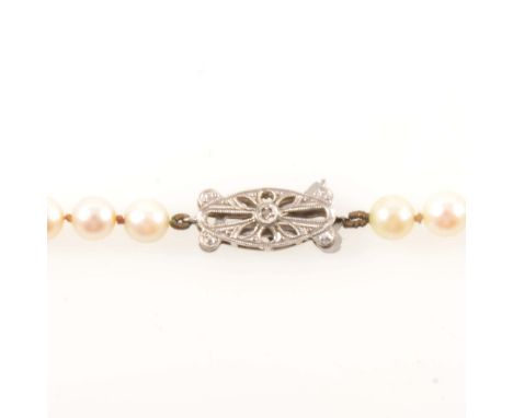 A cultured pearl necklace, eighty-nine 5mm pearls knotted every pearl into a single row 65cm long and fitted with a 9 carat w