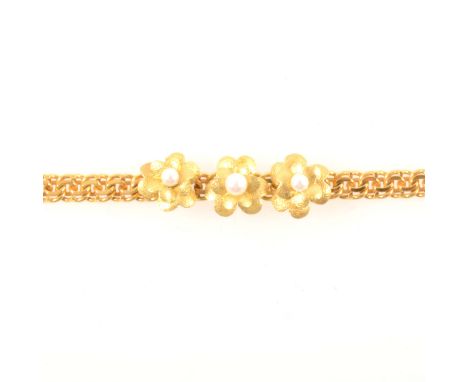 A yellow metal bracelet set with cultured pearls, 5.3mm wide yellow metal flat double curb link bracelet having three frosted