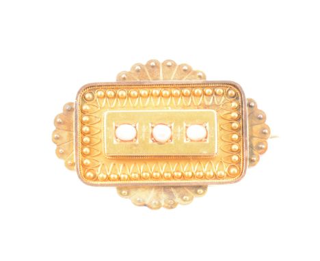 An Etruscan style coral and pearl brooch, two small oval coral and a single pearl set to a plain raised rectangular section i