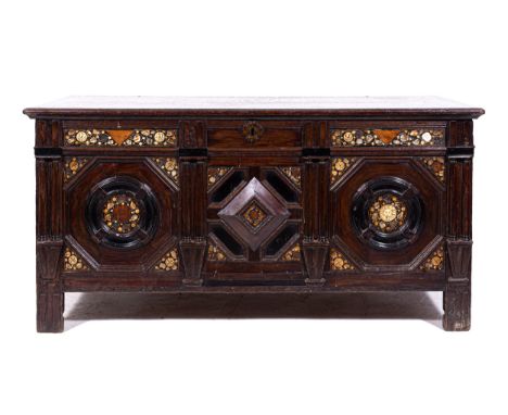 A joined oak coffer, basically late 17th Century, boarded top, front frieze with twinned pilasters, geometric mouldings, ebon