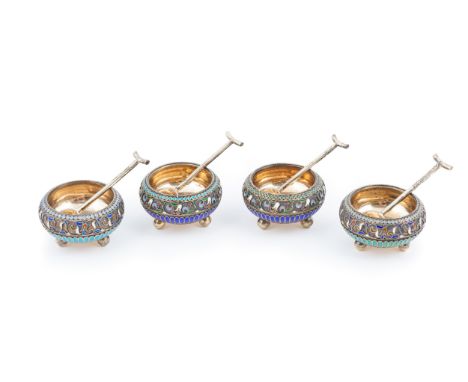 Two pairs of silver-gilt and cloisonné enamel salts with silver spoons by Karl Fabergé , circa 1895, s quat circular form on 