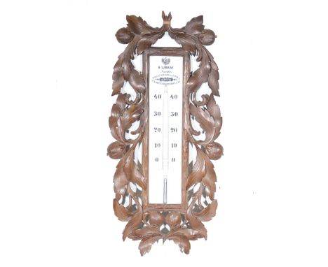 Russian carved wood mercury wall thermometer, V Scwab, Moscow, circa 1900, opaque scale, fruit and leaf carved frame, 68 x 32