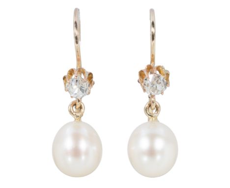 A pair of pearl and diamond drop earrings, the slightly oval pearls 9mm x 8mm, peg set and suspended from an old brilliant cu