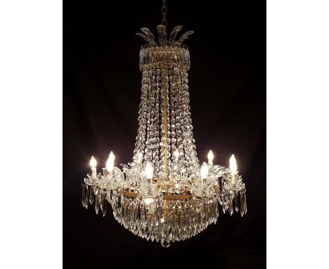 An impressive ten-light cut glass chandelier, by Waterford Crystal, circa 1970, model D10, the ten arms below a crown canopy,