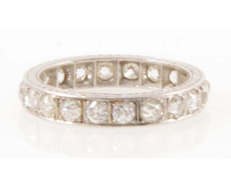 A diamond full eternity ring, twenty old brilliant cut diamonds pip claw and line edge set in a 4mm wide all white metal moun