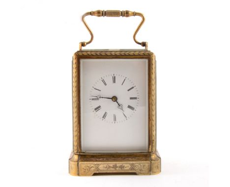 French gilt metal carriage clock, white enamel dial, platform escapement, striking on a bell, case with engraved decoration, 