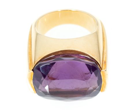 Cartier, attributed - A large amethyst dress ring, the rectangular cushion cut stone 18mm x 15.7mm x 11mm, set horizontally i