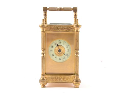 French brass cased carriage clock, gilt fascia with ivorine chapter ring, platform escapement, striking on a gong, case with 