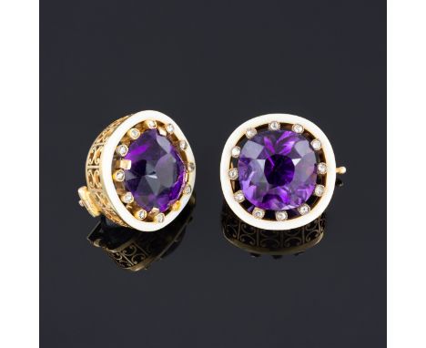 A pair of Fabergé amethyst and diamond lapel brooches, the 13mm faceted cushion cut stones claw set and surrounded by a borde