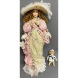The Leonardo Collection Elite Range doll in Edwardian costume & a small doll in a sailors outfit