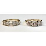 Two 14ct gold (585) cubic zirconia three stone rings, total weight 5.70g