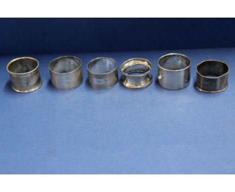 Six various silver napkin rings, 135g.