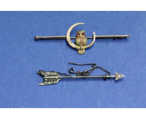 A 9ct gold owl and moon bar brooch, 2.9g; together with an  unmarked arrow pin, 7.9g.   Condition Report:  THE OWL is in two 