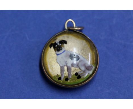 A rock crystal intaglio pendant of a hunting dog in a 9ct mount.