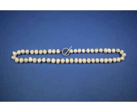 A baroque pearl necklace.