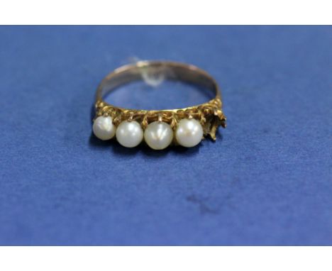 An unmarked gold and pearl ring, (a/f).   Condition Report:  Has one pearl missing