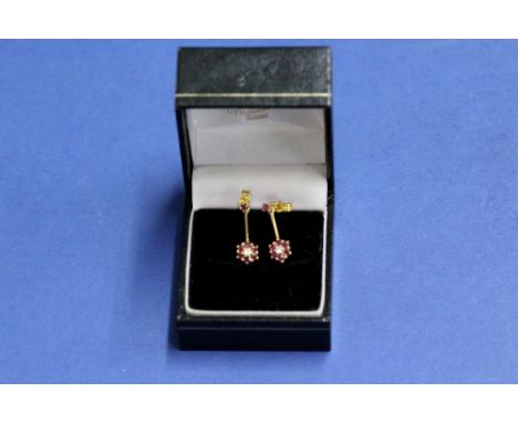 A pair of 9ct gold ruby and diamond floral pendant earrings, 2g in total.