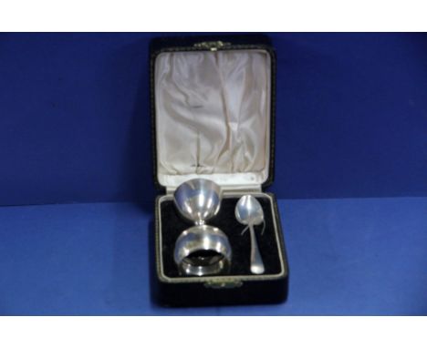 A cased silver christening set, by A L Davenport Ltd, Birmingham 1937, comprising: egg cup; napkin ring and spoon, 57g.