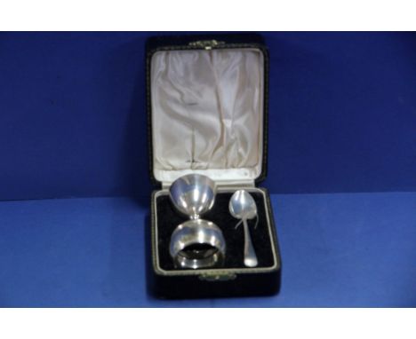 A cased silver christening set, by A L Davenport Ltd, Birmingham 1937, comprising: egg cup; napkin ring and spoon, 57g.