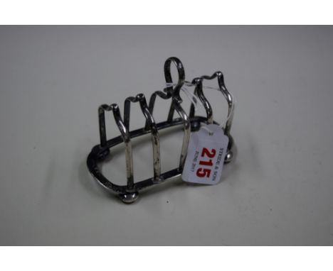 A silver toast rack, by J.G Ltd, Birmingham 1921, 11cm, 93g.