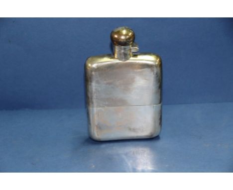 A silver hip flask, by Goldsmiths & Silversmiths Co Ltd, London 1918, 14cm, 272g.   Condition Report:  Dent to top right fron