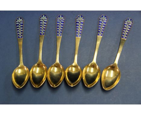 A set of six Soviet era silver gilt and enamel spoons, with Swedish import marks, 14.4cm, 147g.