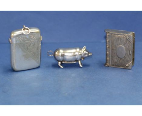 A modern silver pig vesta case, import mark CME, Birmingham; together with a two plated vesta cases.