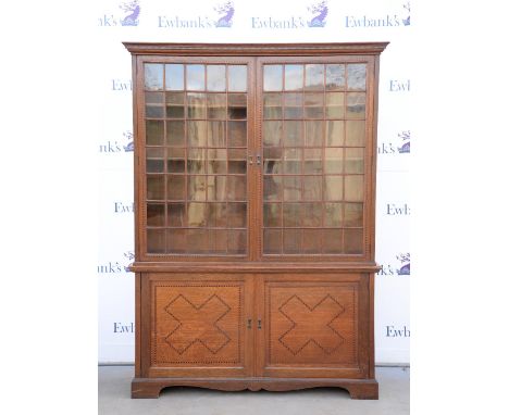  Updated description, Large oak bookcase with two glazed cabinet above two inlaid cabinet doors, inlaid with striped banding.