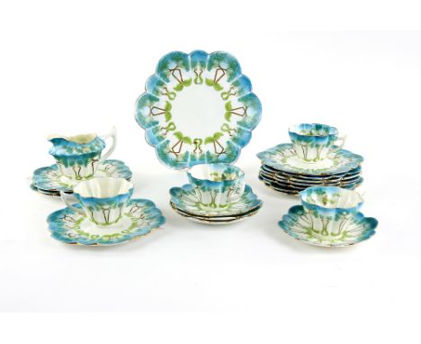 Amended description, Foley part tea set, comprising four cups, four saucers, ten tea plates, a sandwich plate and a milk jug.