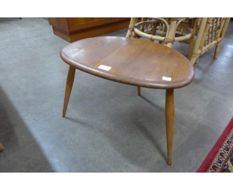 An Ercol elm and beech pebble shaped coffee table 