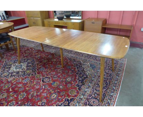 An Ercol Blonde elm and beech extending Grand Windsor dining table 