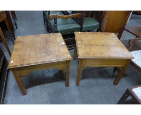 A pair of yew wood lamp tables 