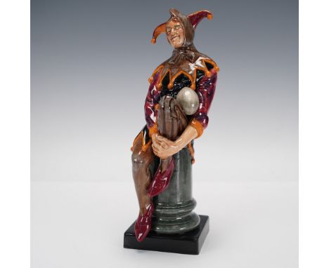1st version, model 170. A court fool seated on a pedestal. Brown, orange, purple. Also called "Jack Point" and "A Jester", th