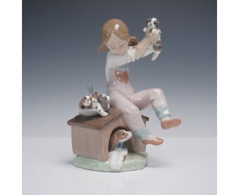 Charming Lladro glazed porcelain figurine titled Pick of the Litter, model number 01007621, designed by renowned artist Salva