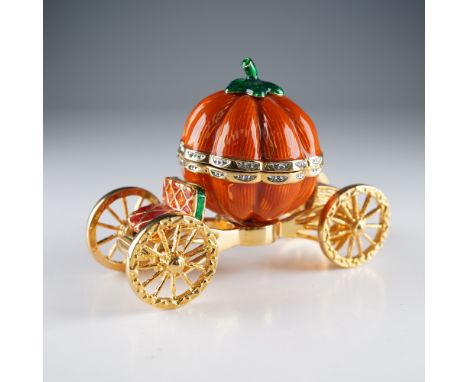 Charming and fairy tale-inspired, this jeweled trinket box by Rucinni is crafted in the shape of a pumpkin carriage. Finished