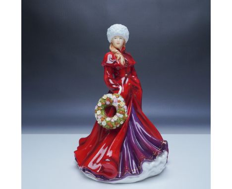 This Royal Doulton figurine, titled Holiday Greetings, features a graceful woman in a vibrant red and purple gown, holding a 