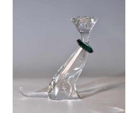 This exquisite Swarovski crystal figurine features a sitting cat adorned with a vibrant green crystal collar. The expertly cr
