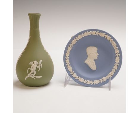 Set of two classic Wedgwood Jasperware pieces in distinct colorways. Includes a pale blue round plate featuring a raised whit