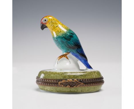 Made in Limoges, France, this whimsical porcelain box is shaped as a perched parrot with brilliant yellow, teal, and cobalt b