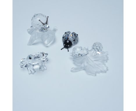 A delightful collection of Swarovski crystal figurines featuring nature-inspired designs. This set includes: Ladybug (190858)