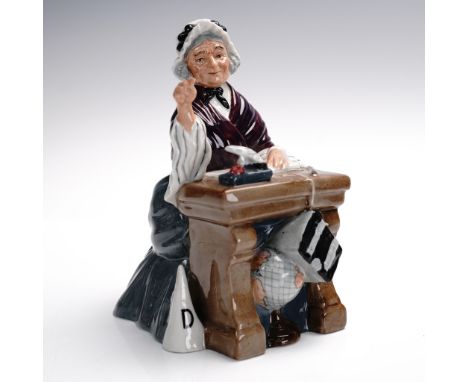 Part of the Professions series. Depicts an elderly woman sitting at a school desk, wearing a purple shawl, white blouse, and 