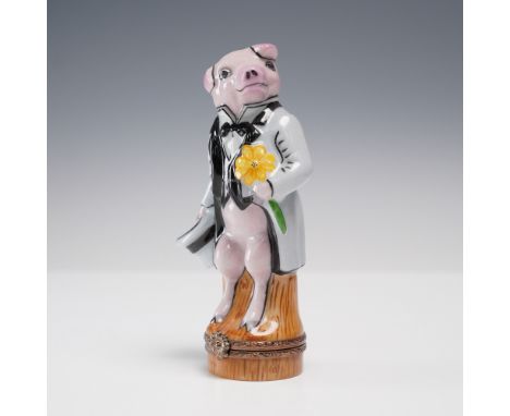 This whimsical hand-painted Limoges porcelain ring box features a debonair pig dressed in a gray tuxedo and top hat, holding 