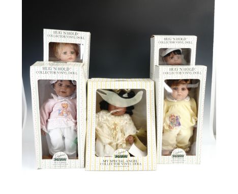 This set includes five Seymour Mann collector vinyl dolls, part of the Hug 'N Hold and My Special Angel series. Each doll fea