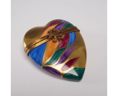 Hand painted in Limoges, France by Rochard, this heart-shaped porcelain box is adorned with vibrant abstract floral leaf moti
