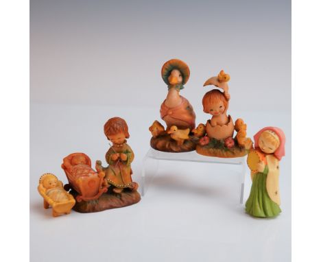 A tender group of five hand carved and painted Anri figurines, each evoking the warmth and whimsy of a nursery setting. The g