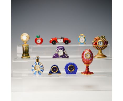 A charming and diverse collection of ten miniature decorative clocks, each with a unique and imaginative design. Included are