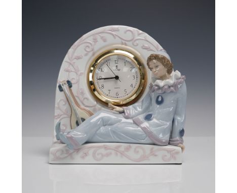 Charming Lladro porcelain clock featuring a pastel blue and lavender Pierrot figure reclining beside a musical lute. Elegant 